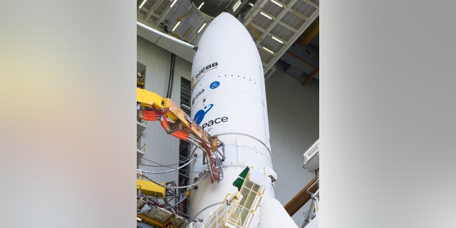 Arianespace's Ariane 5 rocket with NASA's James Webb Space Telescope onboard, is seen in the final assembly building ahead of the planned roll to the launch pad, Thursday, Dec. 23, 2021, at Europe's Spaceport, the Guiana Space Center in Kourou, French Guiana.  (Chris Gunn/NASA via AP