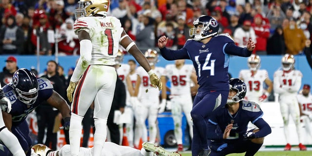 Tennessee Titans kicker Randy Bullock (14) watches his 44-yard field goal in the final seconds of the fourth quarter of an NFL football game against the San Francisco 49ers Thursday, Dec. 23, 2021, in Nashville, Tenn. The field goal gave the Titans a 20-17 win. (AP Photo/Wade Payne)
