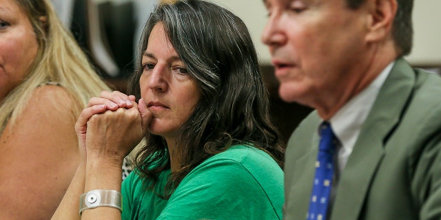 Michelle Lodzinski listens to her attorney, Gerald Krovatin, during a motion to get her a new trial in Superior Court, in New Brunswick, New Jersey, Aug. 23, 2016. (Associated Press)