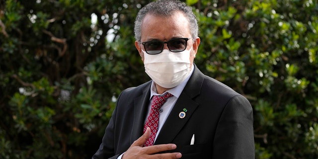 FILE - World Health Organization Tedros Adhanom Ghebreyesus waves as he arrives for a meeting of G20 finance and health ministers at the Salone delle Fontane (Hall of Fountains) in Rome, Oct. 29, 2021.