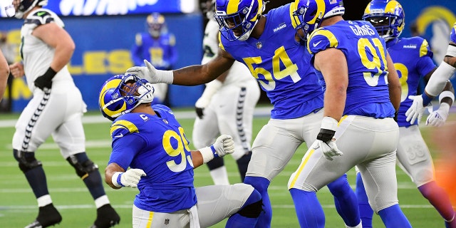 Los Angeles Rams defensive end Aaron Donald celebrates after a defensive stop against the Seattle Seahawks on Dec. 21, 2021, in Inglewood, California.