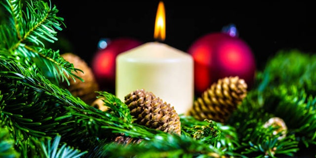 During the Christmas season, an Advent wreath with candles like this one helps Christians prepare for the joyous birth of Jesus on Dec. 25. 