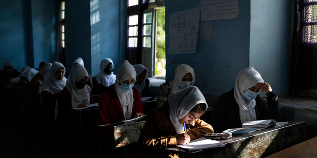 Afghan girls participate in a lesson at Tajrobawai Girls High School, in Herat, Afghanistan, Thursday, Nov. 25, 2021. 