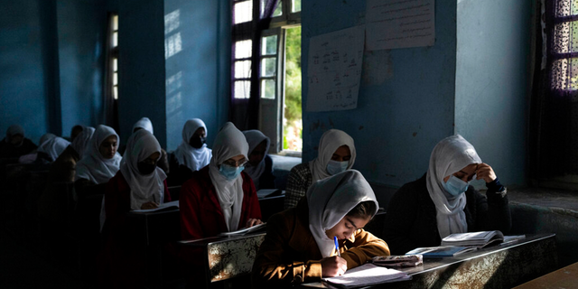 Afghan girls participate in a lesson at Tajrobawai Girls High School, in Herat, Afghanistan, Thursday, Nov. 25, 2021. 