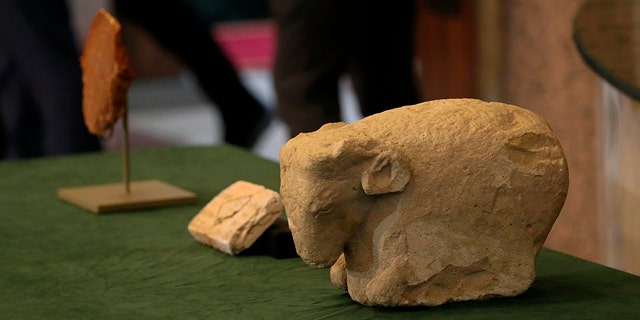 Antiquities recovered from the United States are displayed at the Ministry of Foreign Affairs in Baghdad, Iraq, Tuesday, Dec. 7, 2021. 
