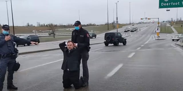 Calgary Police arrest Pastor Artur Pawlowski in the middle of a highway on his way home from church on May 8, 2021. (Courtesy Artur Pawlowski)