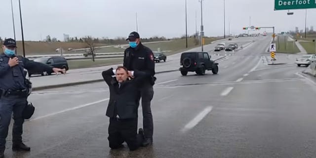 Calgary Police arrest Pastor Artur Pawlowski in the middle of a highway on his way home from church on May 8, 2021. (Courtesy Artur Pawlowski)