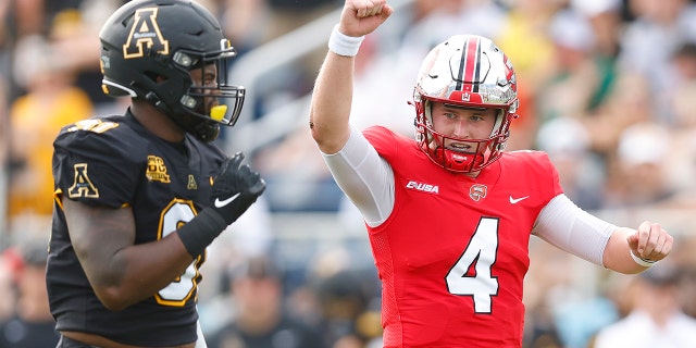BOCA RATON, FLORIDA - DECEMBER 18: Bailey Zappe #4 of the Western Kentucky Hilltoppers celebrates after throwing a five-yard touchdown pass to Joey Beljan #89 (not pictured) against the Appalachian State Mountaineers during the first half of the RoofClaim.com Boca Raton Bowl at FAU Stadium on December 18, 2021 in Boca Raton, Florida.
