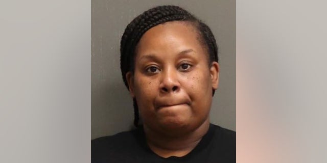 A Nashville mom was arrested Thursday after carrying a semi-automatic handgun into a high school during a physical fight between students, authorities said.