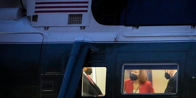 White House Press Secretary Jen Psaki and President Biden sit in Marine One prior to lifting off on the South Lawn of the White House Dec. 17, 2021, in Washington, D.C. 