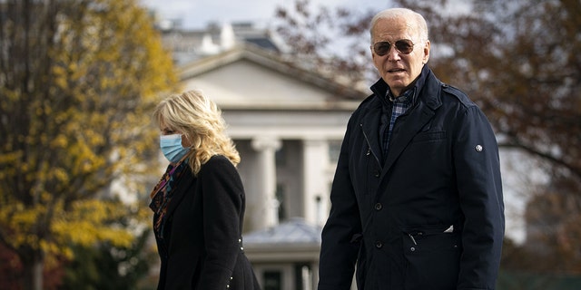 President Joe Biden and first lady Jill Biden on the South Lawn of the White House after arriving in Washington on Sunday, Dec. 5, 2021.