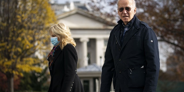 President Joe Biden and first lady Jill Biden on the South Lawn of the White House after arriving in Washington on Sunday, Dec. 5, 2021.