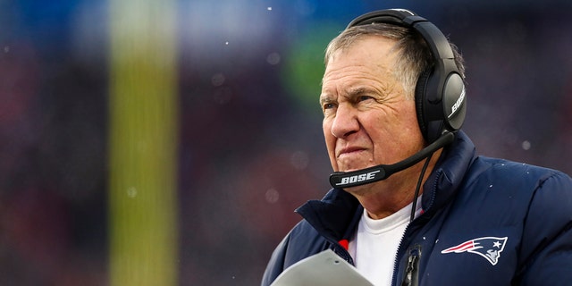 Head coach Bill Belichick of the New England Patriots looks on from the sideline during the second half of the game against the Tennessee Titans at Gillette Stadium on Nov. 28, 2021, in Foxborough, Massachusetts.