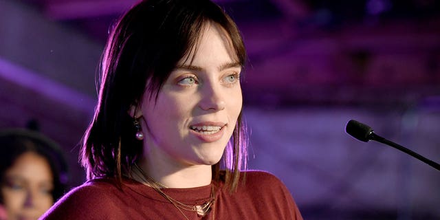 Billie Eilish accepts the award for Movie Song of the Year on stage at Variety's Hitmakers Brunch presented by Peacock |  Girls5eva on December 04, 2021 in Downtown Los Angeles.