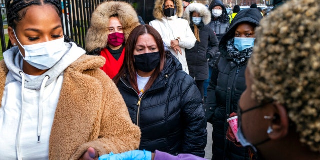 People line up and receive test kits to detect COVID-19 as they are distributed in New York on Dec. 23, 2021. (AP Photo/Craig Ruttle, File)