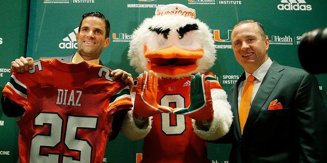 CORAL GABLES, FL - 一月 02:  Head coach Manny Diaz of the Miami Hurricanes (大号) poses for a photo with athletic director Blake James after the introductory press conference in the Mann Auditorium at the Schwartz Center on January 2, 2019 in Coral Gables, 佛罗里达. 
