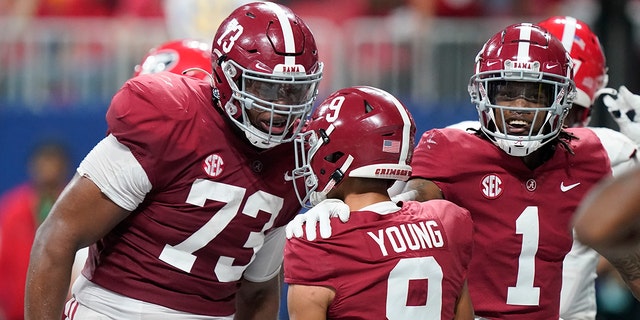 Alabama quarterback Bryce Young (9) celebrates his touchdown against Georgia during the first half of the Southeastern Conference championship NCAA college football game, Saturday, Dec. 4, 2021, in Atlanta.