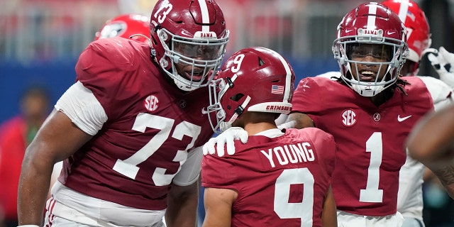 Alabama quarterback Bryce Young (9) celebrates his touchdown against Georgia during the first half of the Southeastern Conference championship NCAA college football game, Saturday, Dec. 4, 2021, in Atlanta.