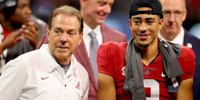 ATLANTA, GEORGIA - DECEMBER 04: Head coach Nick Saban of the Alabama Crimson Tide and Bryce Young #9 of the Alabama Crimson Tide celebrate their win against the Georgia Bulldogs in the SEC Championship game at Mercedes-Benz Stadium on December 04, 2021 in Atlanta, Georgia.