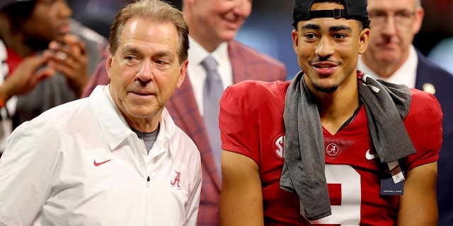 ATLANTA, GEORGIA - DECEMBER 04: Head coach Nick Saban of the Alabama Crimson Tide and Bryce Young #9 of the Alabama Crimson Tide celebrate their win against the Georgia Bulldogs in the SEC Championship game at Mercedes-Benz Stadium on December 04, 2021 in Atlanta, Georgia.