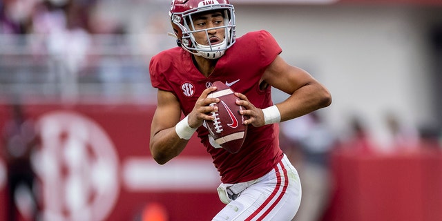 FILE - Alabama quarterback Bryce Young drops back during the second half of an NCAA college football game Oct. 2, 2021, in Tuscaloosa, Ala. Young has been voted The Associated Press college football player of the year.