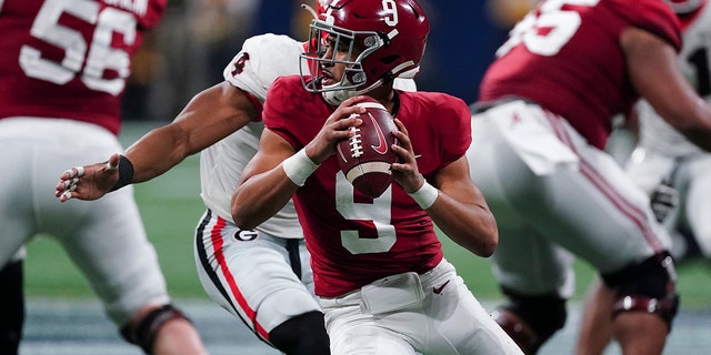 FILE - Alabama quarterback Bryce Young (9) works against Georgia during the second half of the Southeastern Conference championship NCAA college football game Dec. 4, 2021, in Atlanta.