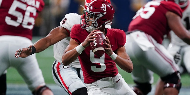 FILE - Alabama quarterback Bryce Young (9) works against Georgia during the second half of the Southeastern Conference championship NCAA college football game Dec. 4, 2021, in Atlanta.