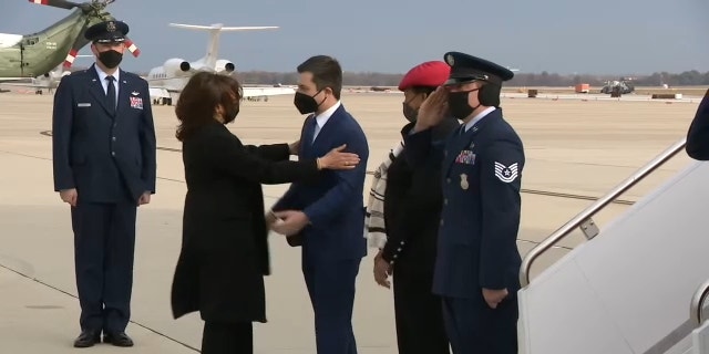 Vice President Kamala Harris and Transportation Secretary Pete Buttigieg embrace before traveling to North Carolina to talk about the bipartisan infrastructure law, Thursday, Dec. 2, 2021.