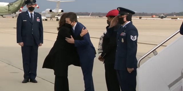Vice President Kamala Harris and Transportation Secretary Pete Buttigieg embrace before traveling to North Carolina to talk about the bipartisan infrastructure law, Thursday, Dec. 2, 2021.