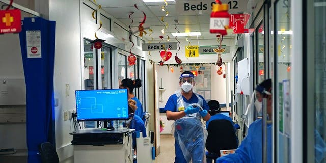 COVID-19 has slammed hospitals and stretched health care systems, including this ward at King’s College Hospital in London. (Victoria Jones/Associated Press)