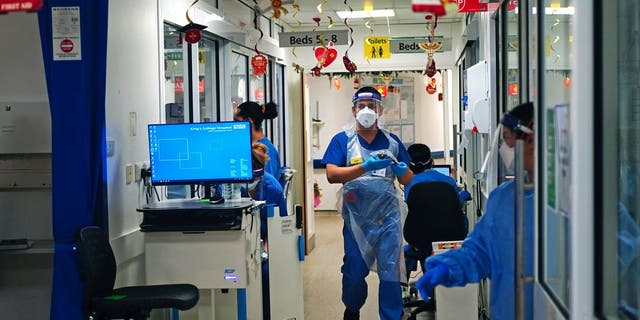 COVID-19 has slammed hospitals and stretched health care systems, including this ward at King’s College Hospital in London. (Victoria Jones/Associated Press)