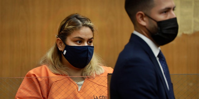 Gabriela Casarez, 26, who has has pleaded not guilty to two counts of child abuse and one count of assault leading to coma or paralysis appeared in Norwalk court with her attorney Jesse Ruiz, right, for a preliminary hearing Dec. 6, 2021.