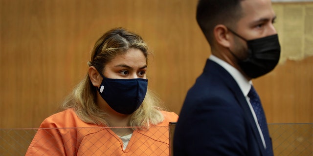 Gabriela Casarez, 26, who has has pleaded not guilty to two counts of child abuse and one count of assault leading to coma or paralysis appeared in Norwalk court with her attorney Jesse Ruiz, right, for a preliminary hearing Dec. 6, 2021.