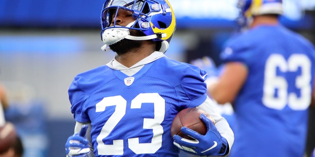 Cam Akers (23) of the Los Angeles Rams runs with the ball during open practice at SoFi Stadium June 10, 2021 in Inglewood, Calif.