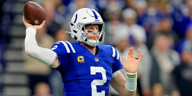 Indianapolis Colts quarterback Carson Wentz will pitch during the first half of an NFL football game against the New England Patriots on Saturday, December 18, 2021 in Indianapolis. 