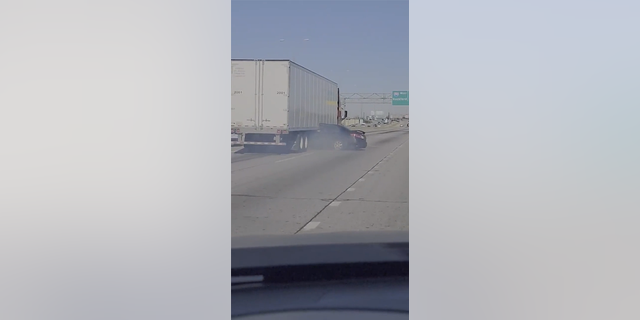 Tractor-trailer drags sedan down Illinois highway