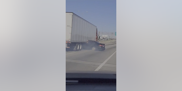 Tractor-trailer drags sedan down Illinois highway