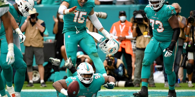 Christian Wilkins (94) of the Miami Dolphins celebrates after scoring on a touchdown reception against the New York Jets in the fourth quarter at Hard Rock Stadium Dec. 19, 2021 a Miami Gardens, Fla.