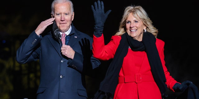 U.S. President Joe Biden, left, and First Lady Jill Biden attend the National Christmas Tree lighting on the Ellipse in Washington, D.C., U.S., on Thursday, Dec. 2, 2021. Biden today called on health providers to expand the availability of coronavirus vaccines and booster shots, aiming to combat a winter surge of infections, and hold off the new omicron variant.