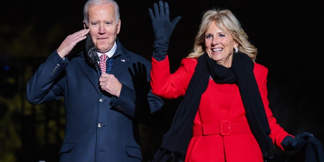 U.S. President Joe Biden, left, and First Lady Jill Biden attend the National Christmas Tree lighting on the Ellipse in Washington, D.C., U.S., on Thursday, Dec. 2, 2021. Biden today called on health providers to expand the availability of coronavirus vaccines and booster shots, aiming to combat a winter surge of infections, and hold off the new omicron variant. 