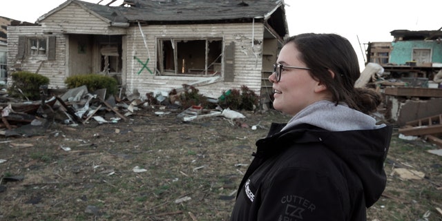 Kaitlynn Kemp walks through Mayfield, Kentucky