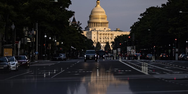 The U.S. Capitol reflected in Washington, D.C., U.S., on Sunday, Oct. 3, 2021.