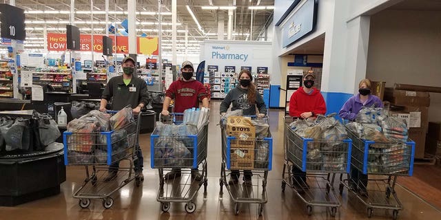 Volunteers with Tyler and Monica Slaven's toy drive buying gifts for children at Nationwide Children’s Hospital in Columbus, Ohio. 