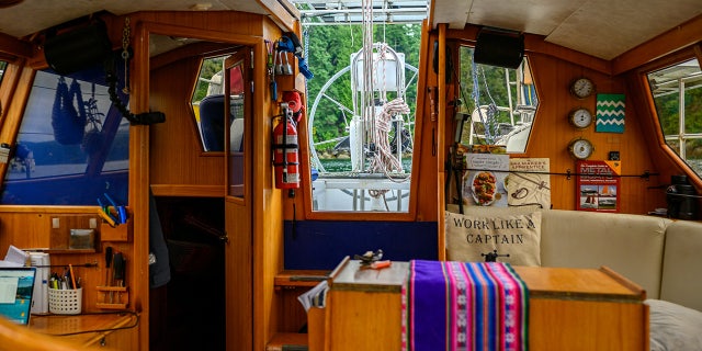 Their current boat has two bedrooms, a kitchen, a bathroom and a large decking area. (SWNS)