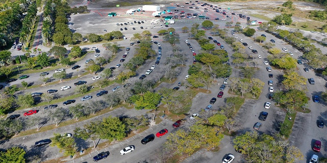 In an aerial view, cars line up at a drive-thru COVID-19 testing site at the Zoo Miami site on Dec. 29, 2021 in Miami, Florida. 