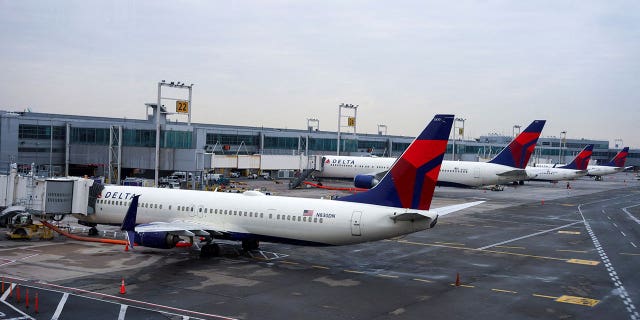 Delta airplanes are seen at John F. Kennedy International Airport after airlines announced numerous flights were canceled during the spread of the Omicron coronavirus variant on Christmas Eve in Queens, New York City, U.S., December 24, 2021.