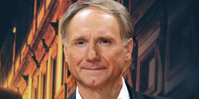 In this Oct. 10, 2016 file photo, author Dan Brown is seen in Berlin, Germany. The ‘DaVinci Code’ author, a resident of New Hampshire, has settled a lawsuit that was filed by his ex-wife, Blythe Brown, over allegations that he led a secret life during their marriage that included several affairs, according to court papers filed Monday, Dec 27, 2021.