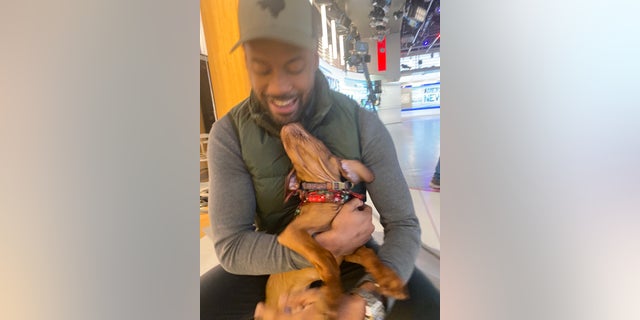 "Fox & Friends" enterprise reporter and "Fox Nation" anchor Lawrence Jones with Percy.