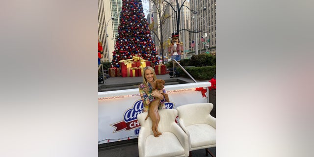 Dana Perino with Percy at Fox News Media headquarters in December 2021.
