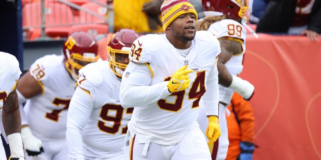 Daron Payne #94 of the Washington Football Team runs out to the field before the game against the Denver Broncos at Empower Field At Mile High on October 31, 2021 in Denver, Colorado.